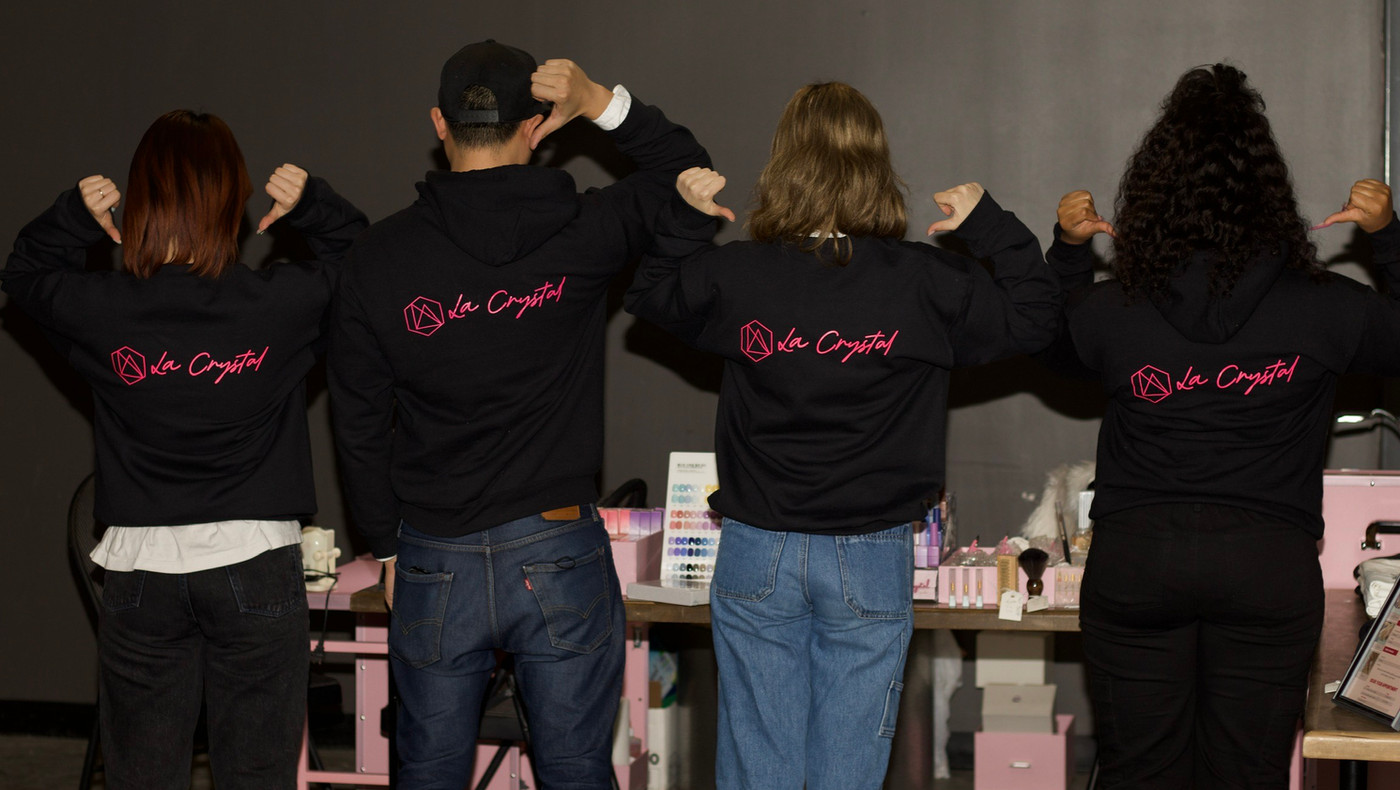The La Crystal team in branded hoodies